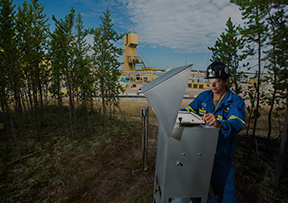 Man in hardhat in forest